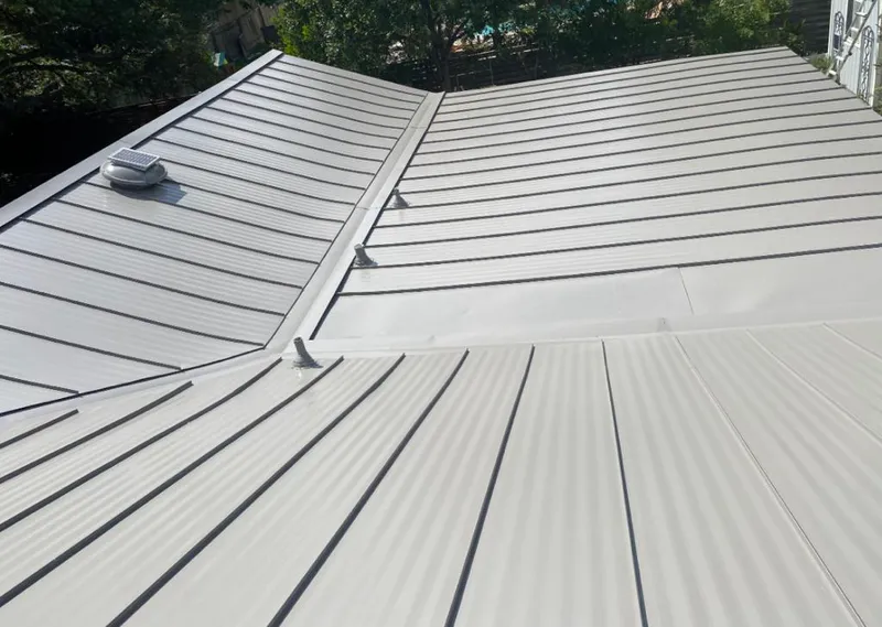 Solar attic fan installed on a metal roof for Roof Ventilation in West Modesto